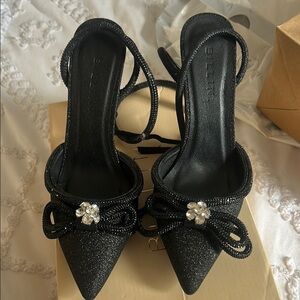 Elegant Black Glitter Heels with Bow by Bellini